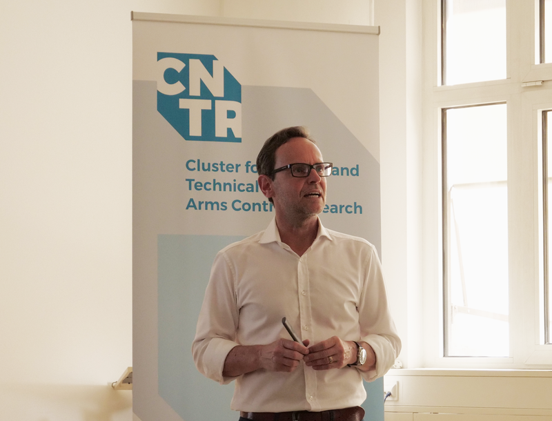 Peter R. Schreiner giving a talk in front of the CNTR logo